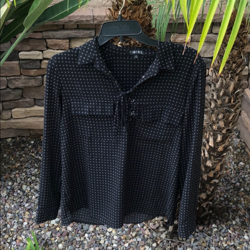 Long sleeve, collared blouse with lace up detail